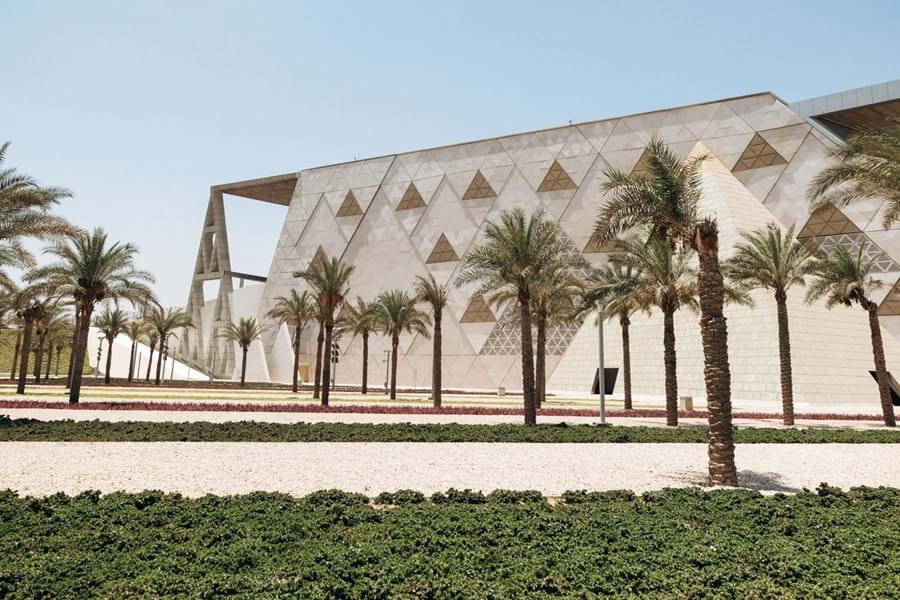 The Grand Egyptian Museum facade and palm-lined approach
